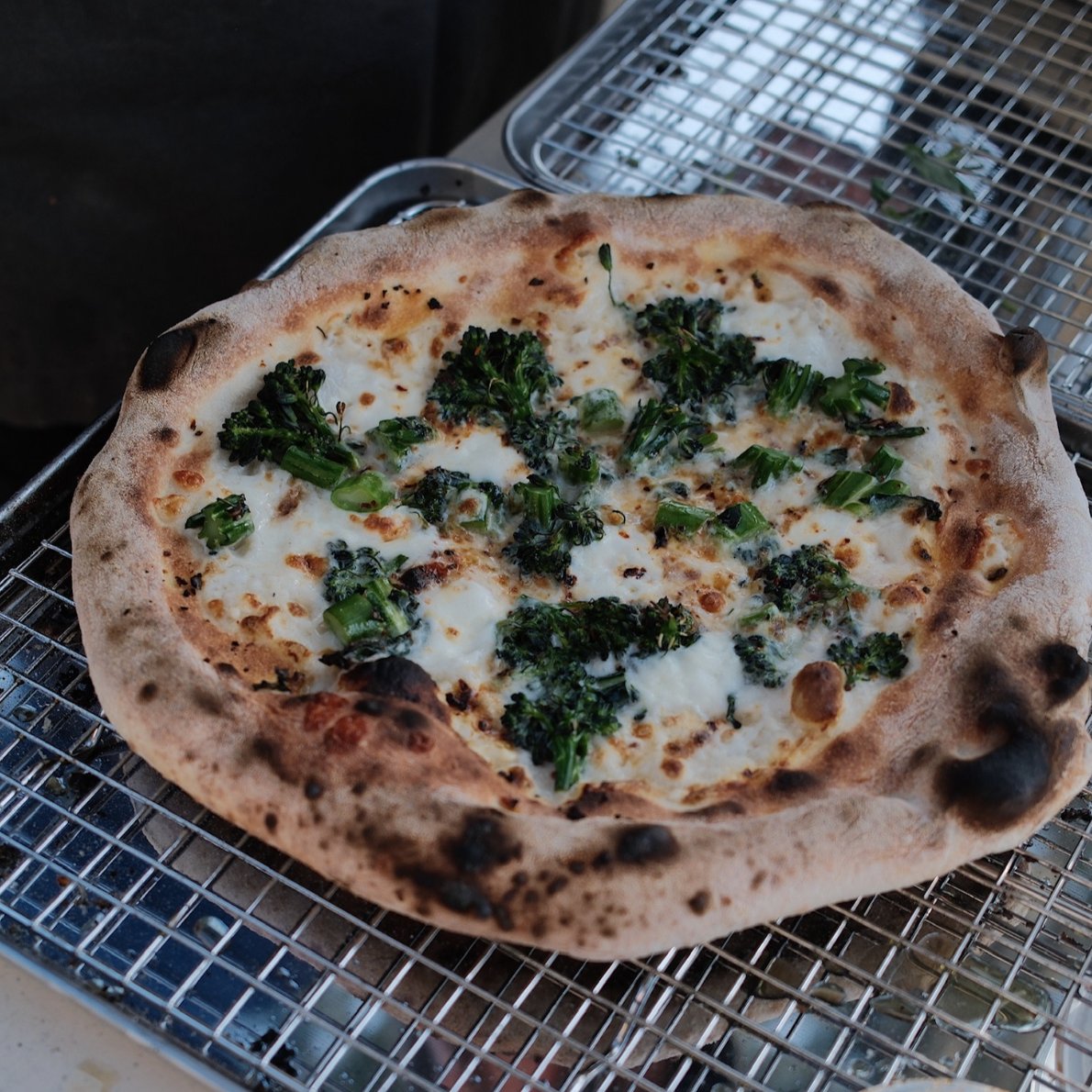Special White pizza with charred broccolini, mozzarella and garlic at Burnt Mouth Pizza Orlando